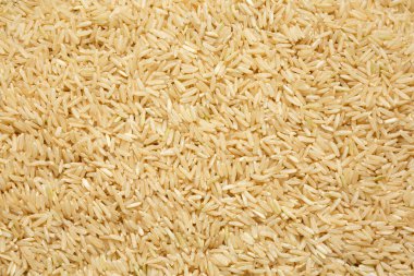 Dry Brown Rice arka planı, üst manzara. Yukarıdan, dümdüz uzanmış. 