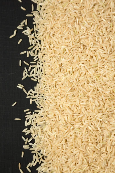 Dry Brown Rice Black Background Top View Overhead Flat Lay — Stock Photo, Image