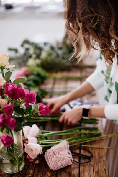 Florist makes a bouquet.