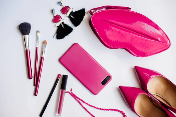 Pink shoes, cosmetics and accessories.