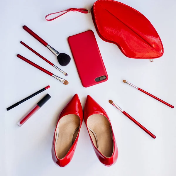 Red shoes, cosmetics and accessories.