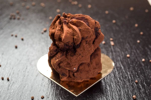 Chocolate truffle cake on stone background