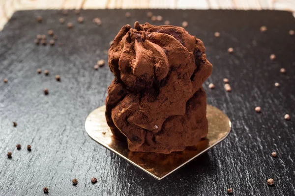 Chocolate truffle cake on stone background