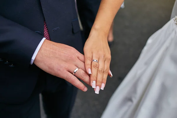 newlyweds wear wedding rings