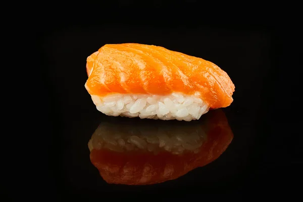 Classical sushi with salmon on black background for menu. Japanese food — Stock Photo, Image