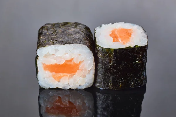 Classical roll sushi with salmon on black background for menu. Japanese food — Stock Photo, Image