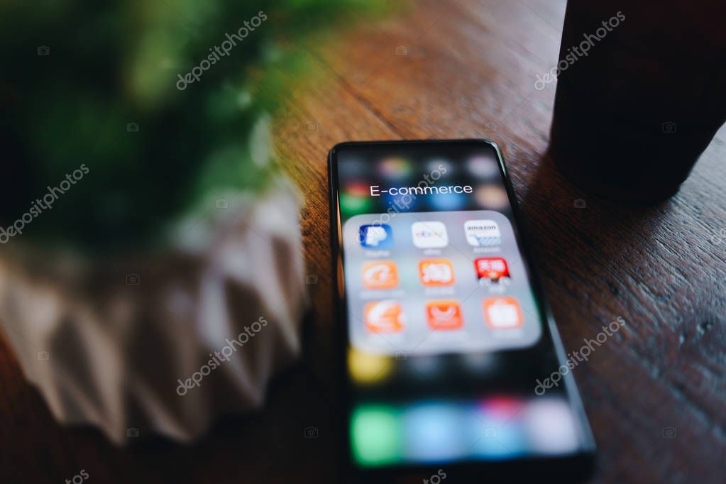 CHIANG MAI, THAILAND - Mar. 24,2019: Xiaomi Mi Mix 3 mobile phone with  icons of E-commerce and online shopping on screen.smartphone lifestyle,e-commerce app concept.