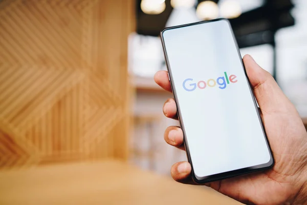 CHIANG MAI, THAILAND - Mar. 23,2019: Man holding Xiaomi Mi Mix 3 with google search on screen. Google is the biggest Internet search engine and online advertising technologies in the world — Stock Photo, Image