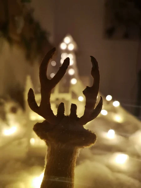Detail of a Christmas decoration, toy deer on a snowy background — Stock Photo, Image