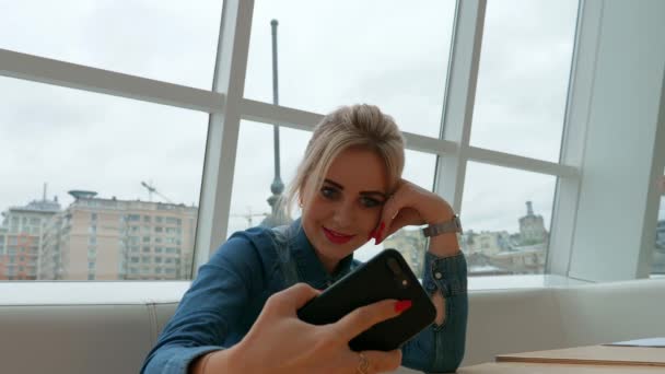 Girl Blonde Blue Denim Shirt Makes Selfie Cafe — Stock Video