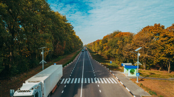 Aerial view of the new road in Ukraine. Autumn. Road marking.