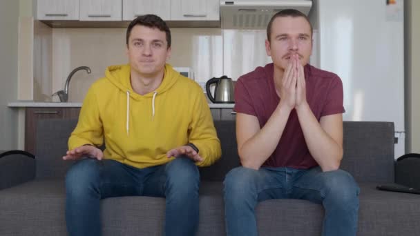 Two Superstitious Fans Pray Victory Favorite Football Team Two Men — Stock Video