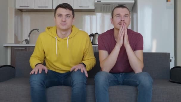 Two Superstitious Fans Pray Victory Favorite Football Team Two Men — Stock Video