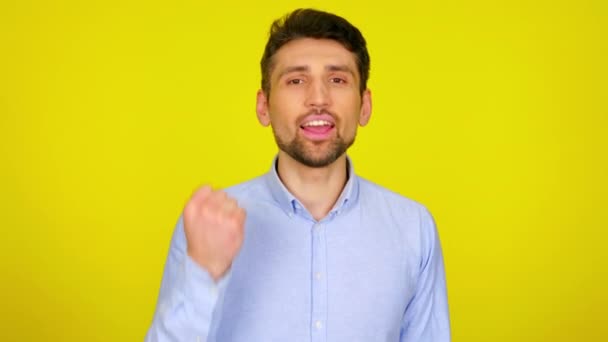 Man celebrates the victory of his beloved team shaking hand in front of him — Stock Video