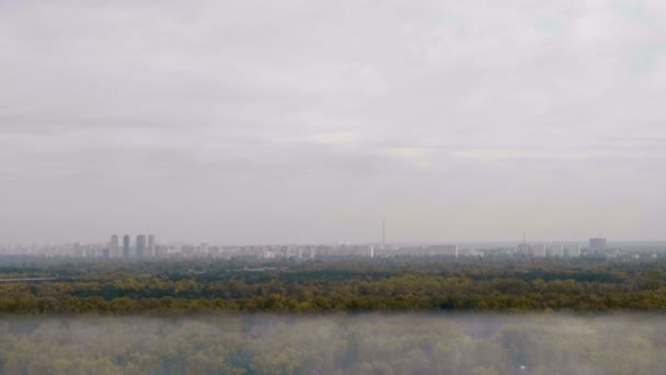 View of the apocalyptic city: cloudy sky fog forest trees abandoned buildings — Stock Video