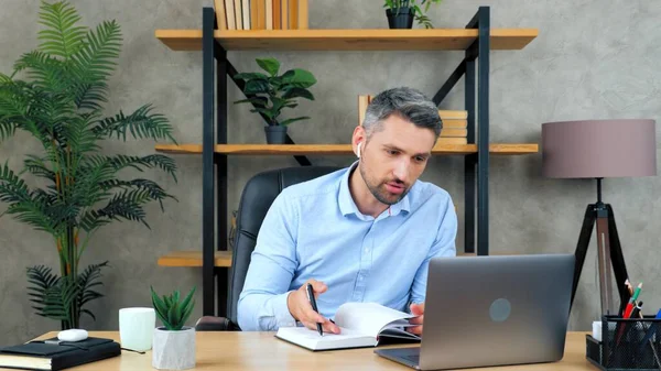 Man makes remote online videocall conference chat with company employees — стоковое фото