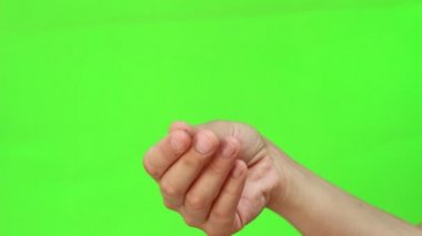 El hareketi (Dizin ve orta parmak karşı başparmak ovalama) para için. El hareketi. İzole. Yeşil ekran Chromakey