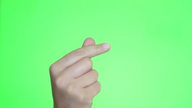 Kore parmak kalp jest. El yakın çekim. Chroma anahtar arka plan. Yeşil ekran. İzole