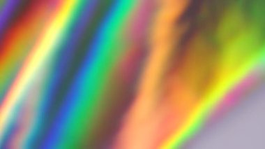 Holografik folyo arka plan. Gökkuşağı degradesi. Dinamik hareket