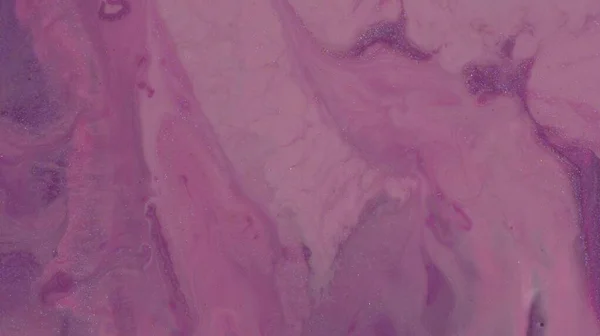 Lilac purple, violet, lavender paint flows. Shiny liquid pastel background