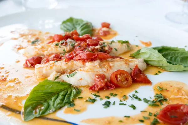 Cod with tomato and basil