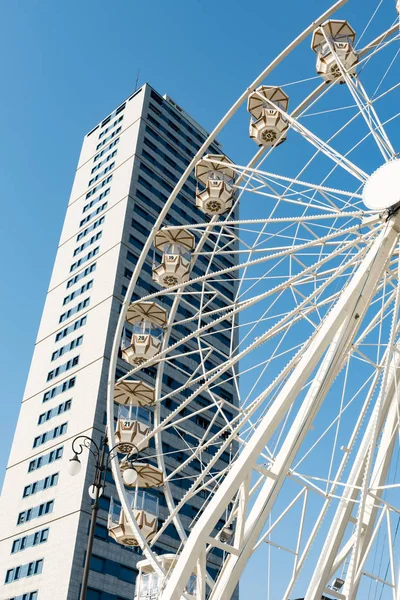 Ferris wheel with blue sky