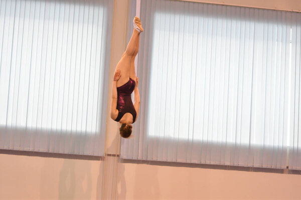 Girls compete in jumping on the trampoline on competitions at the Orenburg region among Junior