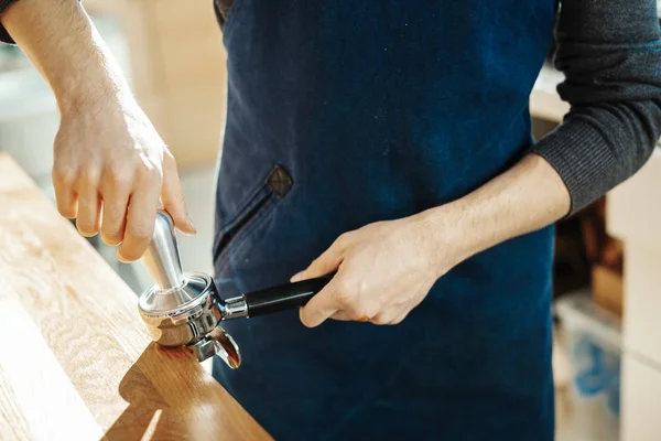 Close up of barista with tamper and piston or portafilter making espresso. — Stock Photo, Image