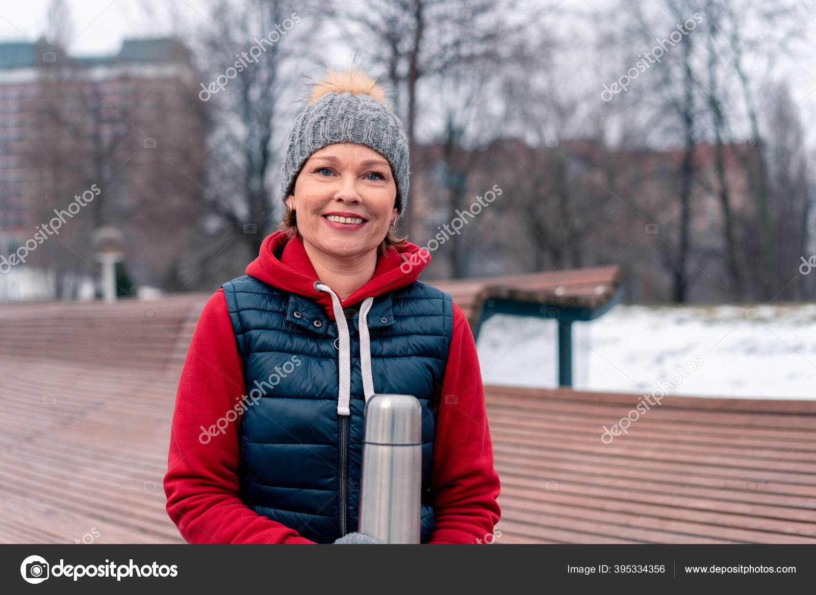 Beautiful Mature Woman Hot Holding Thermos In Park After Active