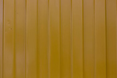 Metalik sarı yüzeye dikey çizgili desen doku arka plan