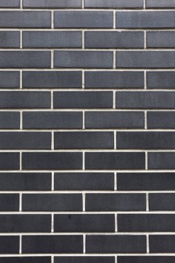 Beyaz taş siyah tuğla duvar desen doku arka plan dikey atış dikişleri