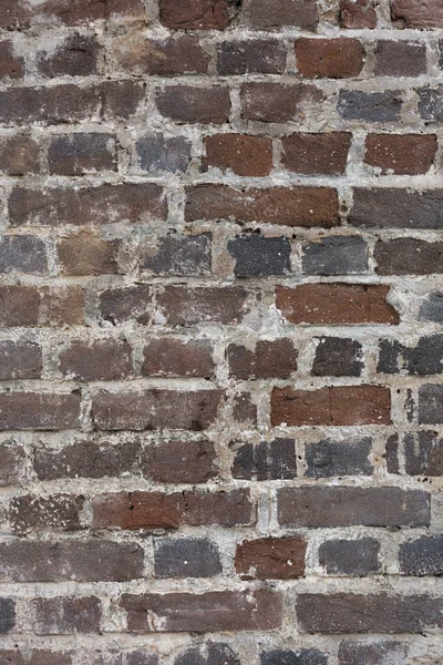 Eski kırmızı rustik taş tuğla duvar dikey ışıma doku arka plan