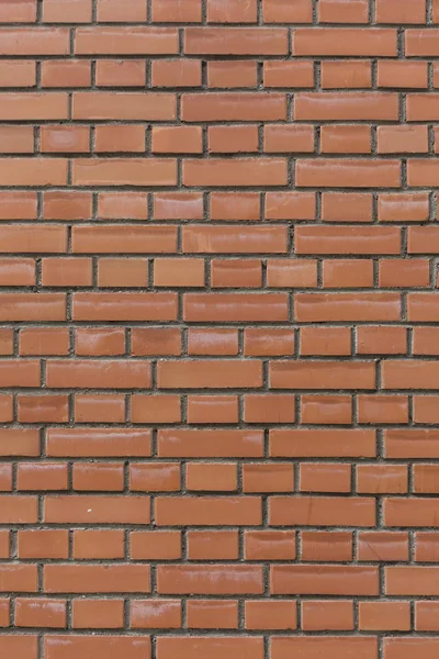 Vermelho com costuras pretas tijolos de pedra padrão de parede textura sem costura fundo vertical — Fotografia de Stock