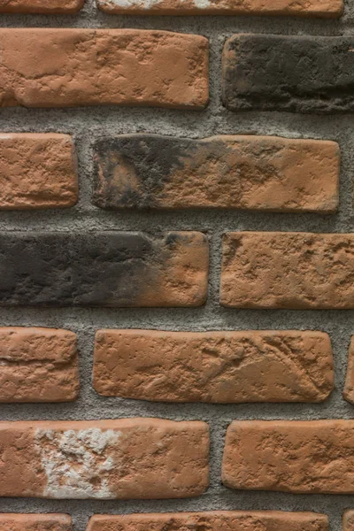 Piszkos vörös kő-tégla fal mintás textúra háttér függőleges közelről — Stock Fotó