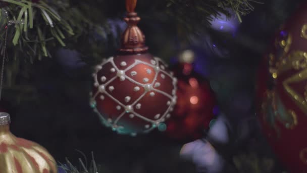 Christmas and New Year Decoration in red color. Abstract Blurred Bokeh Holiday Background. Blinking Garland. Christmas Tree Lights Twinkling. — Stock Video