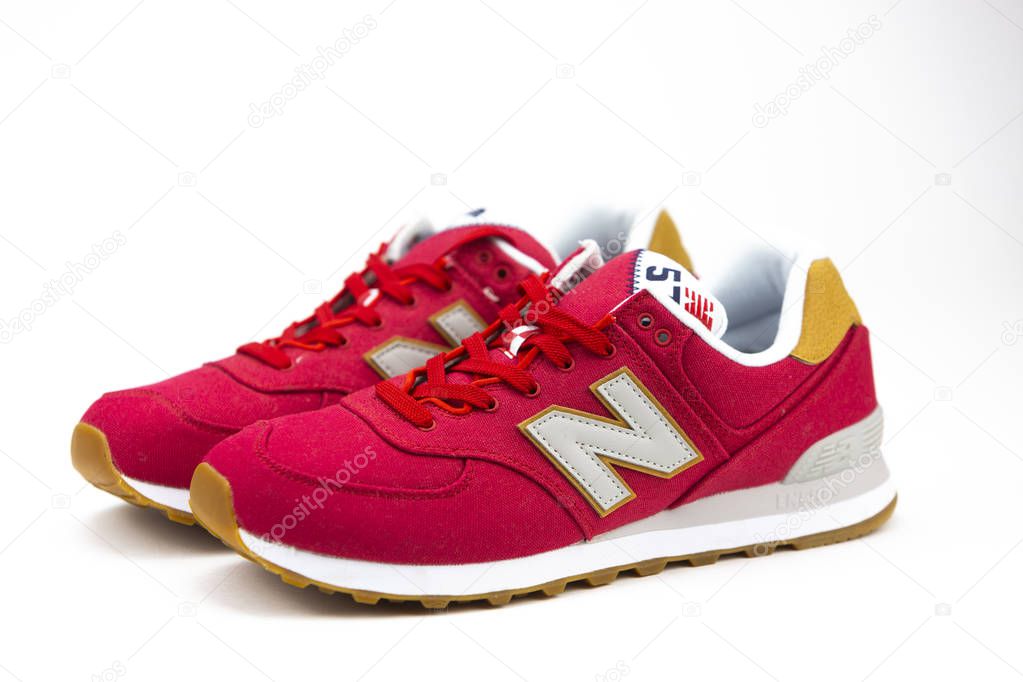 New Balance NB 574 athletic shoes on studio background. New Balance Athletics one of the worlds major sports footwear manufacturers