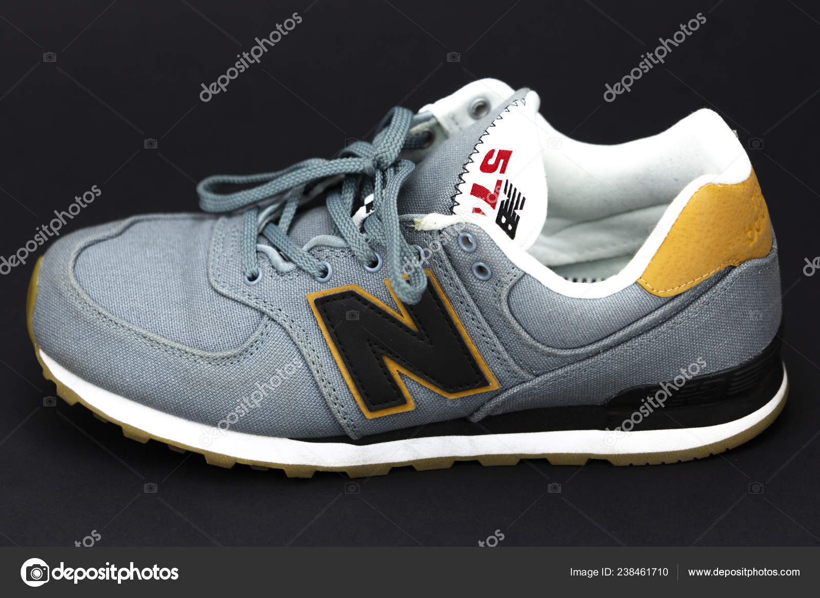 New Balance NB 574 athletic shoes on 