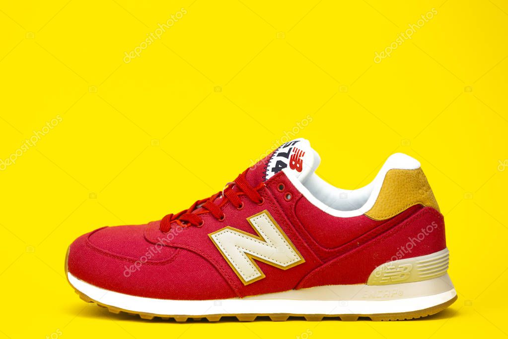 New Balance NB 574 athletic shoes on studio background. New Balance Athletics one of the worlds major sports footwear manufacturers