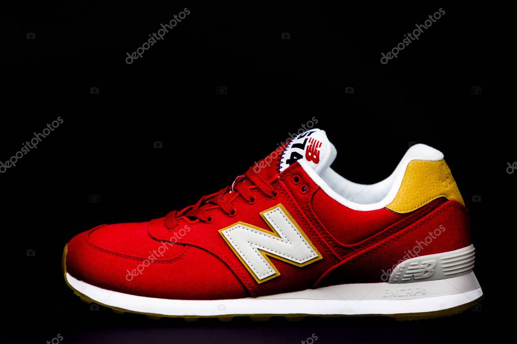 New Balance NB 574 athletic shoes on studio background. New Balance Athletics one of the worlds major sports footwear manufacturers