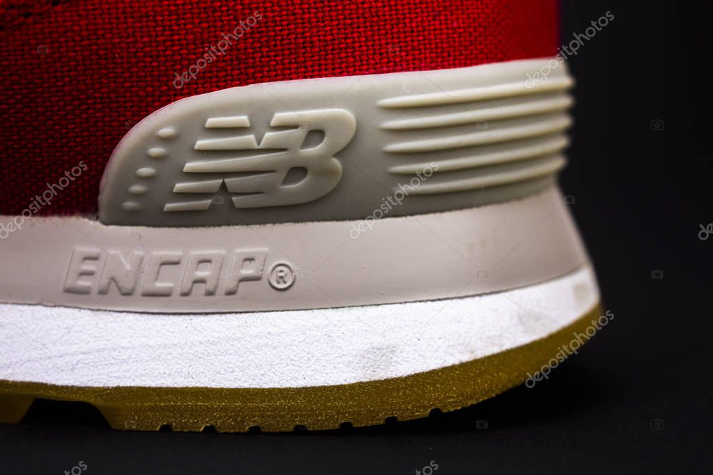 New Balance NB 574 athletic shoes on studio background. New Balance Athletics one of the worlds major sports footwear manufacturers