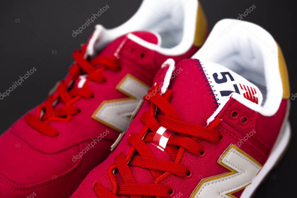 New Balance NB 574 athletic shoes on studio background. New Balance Athletics one of the worlds major sports footwear manufacturers
