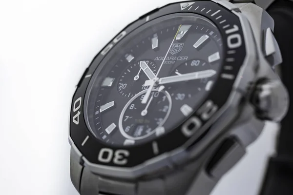 Chaux-de-Fonds, Switzerland, August 21 2019 - The close up of Tag Heuer Aquaracer steel black mecanical watch, a famous swiss made luxury wrist watch from Switzerland manufacturing clock company — Stock Photo, Image