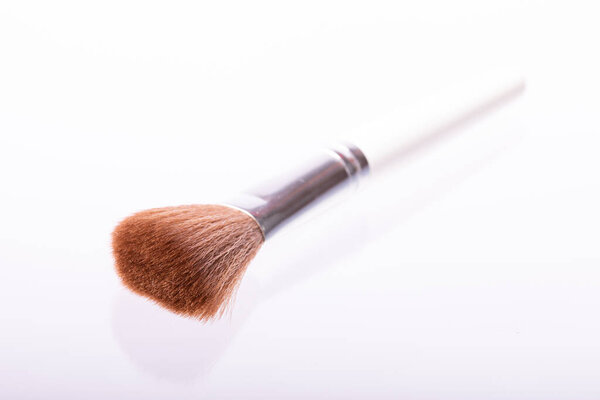 makeup brush for powder and blusher isolated on white background selective focus