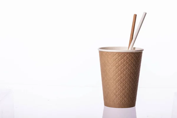 Disposable brown paper cup waffle texture with straws, isolated white background — Stock Photo, Image