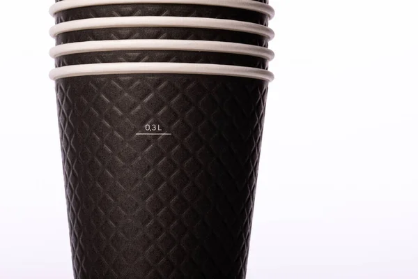 Stapel av svart engångs biologiskt nedbrytbart papper takeaway cups 0,3 L närbild — Stockfoto