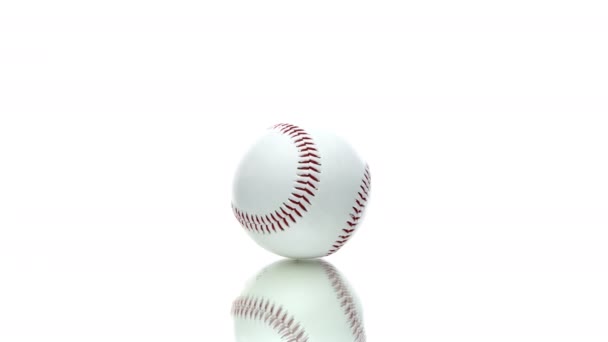 Baseball ball reflecting in glass table spinning rotating 360 isolated on white — Stock Video