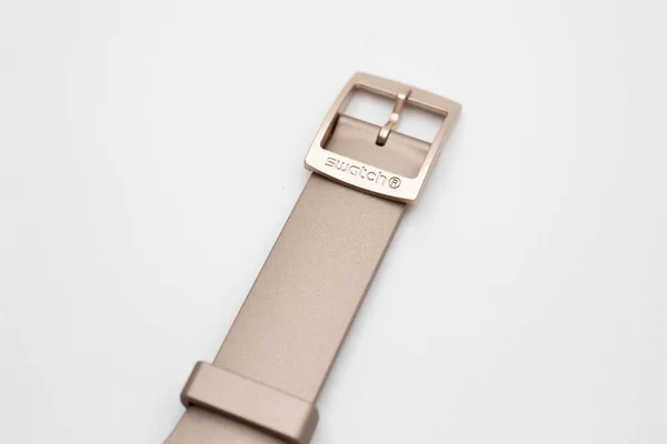 Rome, Italy 07.10.2020 - Swatch logo on beige swiss made watch wrist strap — Stock Photo, Image