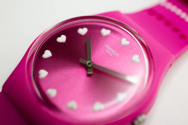 Roma, Italia 07.10.2020 - Swatch logo on pink wristwatch dial Love hearts design —  Fotos de Stock