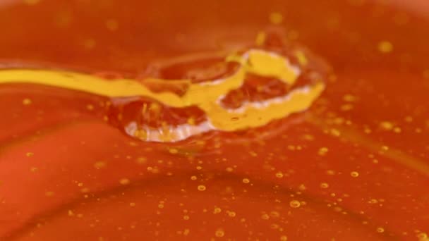 Melted pine resin amber color viscous fluid flows in beautiful flow slow motion — Stock Video