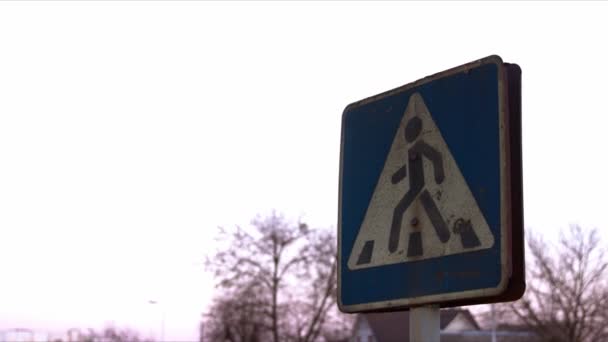 A rusty pedestrian crossing sign. An evening sky is at the background. — Stock Footage A rusty pedestrian crossing sign. An evening sky is at the background. Stock Footage